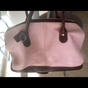 Top quality leather. Has shoulder strap